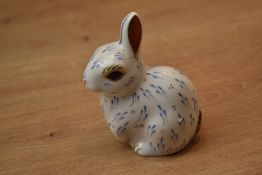 A Royal Crown Derby bone china Snowy Rabbit paperweight, having Imari style decoration with gold