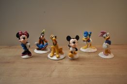 A group of six Royal Doulton bone china Mickey Mouse Collection figures, in celebration of 70