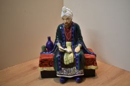 A Reg Johnsons and Sons, Formerly of Royal Doulton, bone china figure 'Omar Khayyam', measures 18.