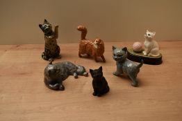 A selection of Royal Doulton and Beswick Pottery Cat/Kitten studies comprising Swiss Roll Persian on