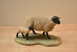 A Border Fine Arts animal group 'Suffolk Ewe and Lamb' model number 119 designed by Ray Ayres,