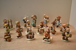 A group of sixteen Goebel porcelain figures and figurines to include 'Wayside Harmony' model