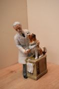 A Royal Doulton bone china figure 'Thanks Doc!' HN 2731, measures 22cm tall.