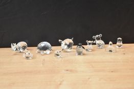 A group of Swarovski Crystal glass animal studies including pigs, rhino and seal etc.