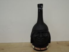 Inca Pisco Brandy, Lima Peru, in black embossed character bottle, 750ml, no strength stated, base of