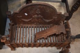 A traditional cast iron dog grate