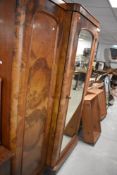 A Victorian walnut breakfront mirror door wardrobe, width approx. 206, height 197cm
