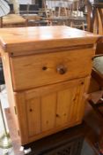 A vintage pine beside cabinet