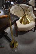 A modern brass reading lamp
