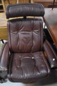 A Stressless style brown leather easy chair and footstool
