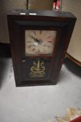 An American style wall clock, printed Ansonia to interior of case