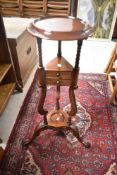 A reproduction occasional table in the wig stand style, height approx. 88cm