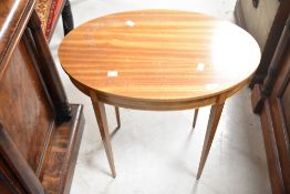 An Edwardian style occasional top having oval top and square tapered legs, width approx. 59cm