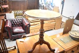 A Victorian mahogany occasional table having circular top on turned column and triple splay legs,