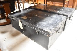 Two large deed style metal travel trunks