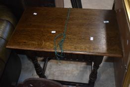A traditional oak side table in the Priory style, width approx. 76cm