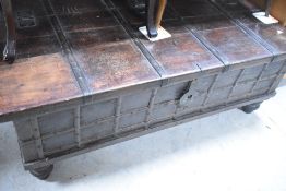 A hardwood sea fairer style storage chest, possibly Middle Eastern, with strap work design and heavy