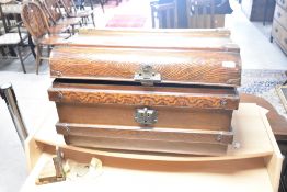 A tin trunk, of simulated wood design, width approx. 62cm