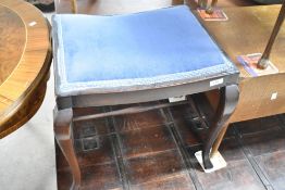An early 20th Century dark stained dressing table stool, width approx. 50cm