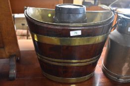 An antique coopered barrel style bucket having brass liner and a similar miniature sherry cask