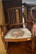 An Edwardian mahogany carver chair having line inlay decoration