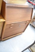 A vintage teak 'secretary' bureau having pull out desk section , width approx. 90cm, height 110cm