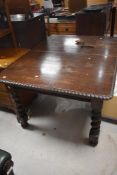 A late 19th or early 20th Century oak wind out dining table on heavy twist legs, approx. 142 x