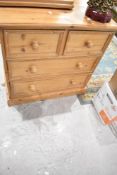 A natural pine chest of two over two drawers