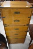 A reproduction campaign style narrow chest of drawers, dimensions approx. H120 W54 D43cm