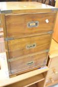 A reproduction campaign style bedside chest of three drawers, dimensions approx. W40 D37 H60cm