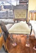 A Victorian mahogany dining chair having overstuffed seat and back