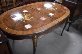 A vintage Continental style extending dining table