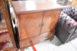 A reproduction Regency style TV cabinet