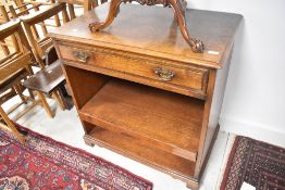A reproduction oak computer work station with drop down door front, concealed keyboard shelf and and