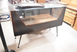 A mid Century modern shop display cabinet having glazed top section with velvet lined drawers to