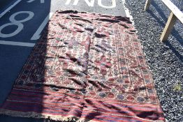 A Persian rug, approx 240 x 170cm