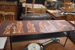 A 1960's laminate coffee table, of oblong form decorated with Neo Classical figures and repeating