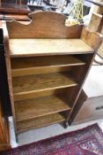 A late 19th or early 20th Century oak bookshelf in the Arts & Crafts style, width approx. 61cm
