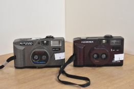 A Hanimex 35DL dual lens 35mm camera and a Miranda TL200 dual lens 35mm camera.
