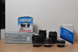A collection a lenses. A Canon 100mm f2.8, a Carl Zeiss Jena 135mm f3.5, a Hanimex 28mm f2.8,