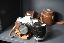 Beseler Topcon Auto 100 35mm SLR w/Topcor 53mm f/2 Lens and Topcor 135mm f4 lens.