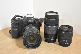 A Canon 5D digital camera, a Canon EF 75-300mm f4.5-5.6 lens, a Canon 28-90mm f4.5-5.6 lens, a Canon