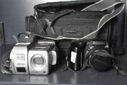 A Samsung SCD5000 digital camcorder with accessories and bag. Sold alongside an Olympus SP-500UZ