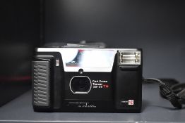 Yashica T AF 35mm compact camera, with a built in Carl Zeiss Tessar 35mm f/3.5 lens. With camera