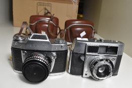 Two 35mm cameras, an Agfa Optima I and an Exakta Exa Iia, both with leather cases and straps and