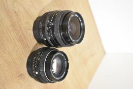 A Pentax 50mm f1.7 lens and a Sigma 35-70mm f3.5-4.5 lens.