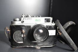 A Zorki 4K 35mm rangefinder camera with Jupiter-8 50mm f/2 Lens, with black leather case and strap.
