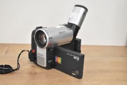 A Canon MV10 MiniDV camcorder, with accessories and tapes, in a black padded camera bag.