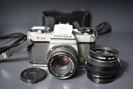 Asahi Pentax K1000 35mm SLR, sold with a SMC Pentax-M/A 50mm f/2 lens and a SMC Pentax 50mm f/1.7