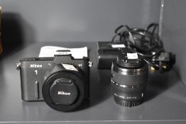 Nikon 1 V1 mirrorless camera, with Nikon 1 Nikkor 10-30mm f/3.5-5.6 VR and Nikon 1 Nikkor 30-110mm